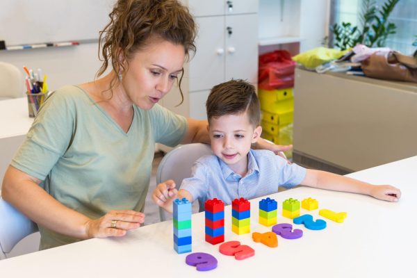 teacher woman learn  preschooler boy to count